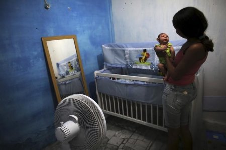 Daniele Santos 29 holds her son Juan Pedro who is 2-months old and born with microcephaly at their house in Recife Brazil