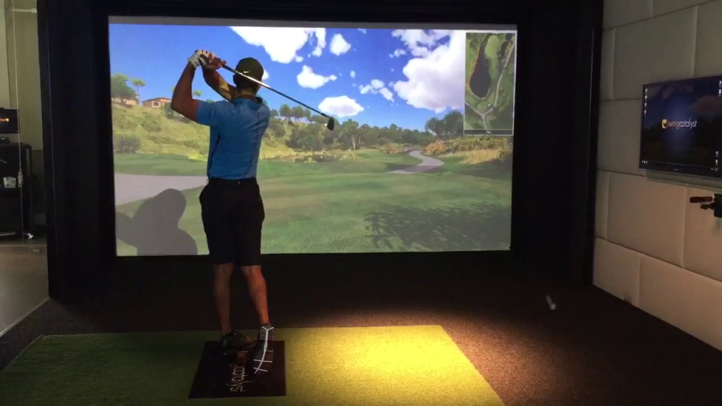 Tiger Woods hitting balls on his simulator