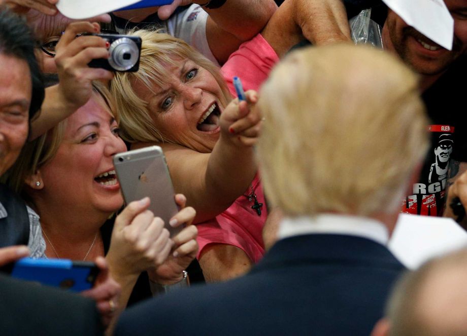 Supporters clamor for the attention of presidential candidate Donald Trump at a rally Monday in Las Vegas