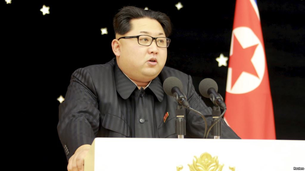 North Korean leader Kim Jong Un attends a banquet for contributors of the recent rocket launch in this undated