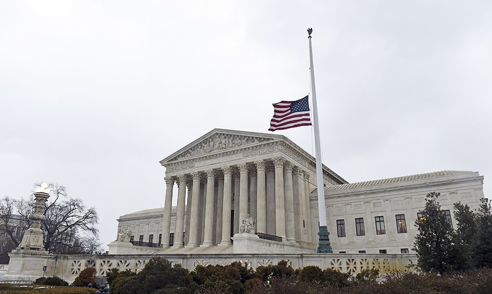 The flag flies at half-staff outside the Supreme Court in Washington following the death of Justice Antonin Scalia over the weekend. The Associated Press