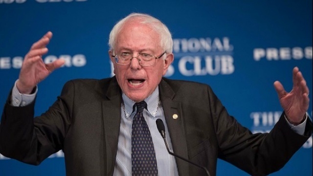 US elections Bernie Sanders attacks Hillary Clinton's stances on Iraq war trade policies