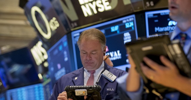 Traders work on the floor of the New York Stock Exchange