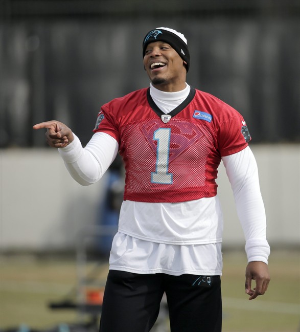 Carolina Panthers quarterback Cam Newton jokes with teammates during practice for the NFL football team in Charlotte N.C. Wednesday Jan. 27 2016. The Panthers will meet the Denver Broncos in Super Bowl 50 in Santa Clara Calif. on Feb. 7.(AP