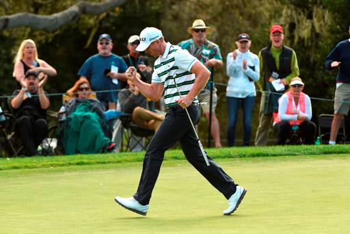 Vaughn Taylor celebrates after making his putt on the 16th hole