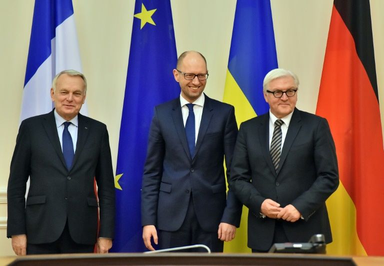 Ukrainian Prime Minister Arseniy Yatsenyuk poses with German Foreign Minister Frank Walter Steinmeier and French Foreign Minister Jean Marc Ayrault prior to talks in Kiev