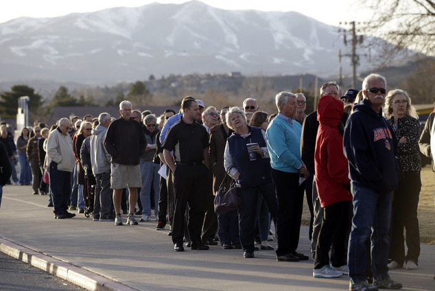 Voters line up to to vote in the Republican party caucus Tuesday Feb. 23 2016 in Reno Nev