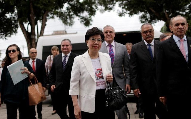 World Health Organization Director General Margaret Chan and Brazil's Health Minister Marcelo Castro arrive at the IMIP hospital in Recife Brazil