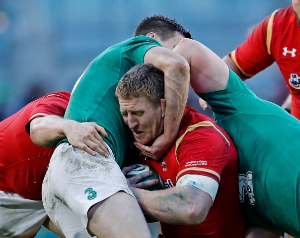 Wales Bradley Davies is caught by the Irish defence