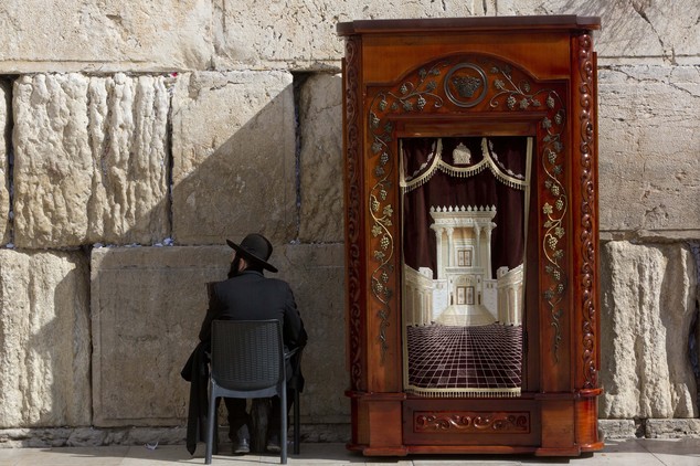 An ultra Orthodox Jewish man sits at the Western Wall the holiest site where Jews can pray in Jerusalem's Old City Monday Feb. 1 2016. The Israeli govern