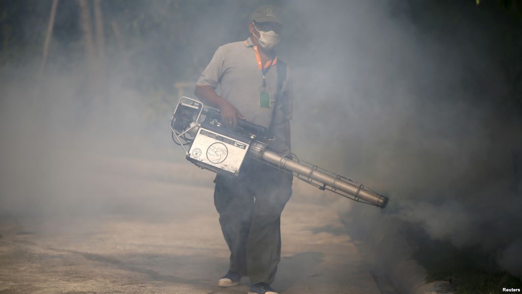 A worker sprays insecticide for mosquitos at a village in Bangkok Thailand Jan. 13 2016. Tropical Southeast Asian countries said they were bracing for the Zika virus with Malaysia saying it could'spread quickly if introduced