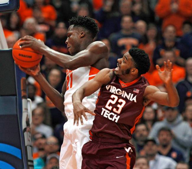 Syracuse's Tyler Roberson left battling Virginia Tech's Jalen Hudson for a rebound Tuesday night