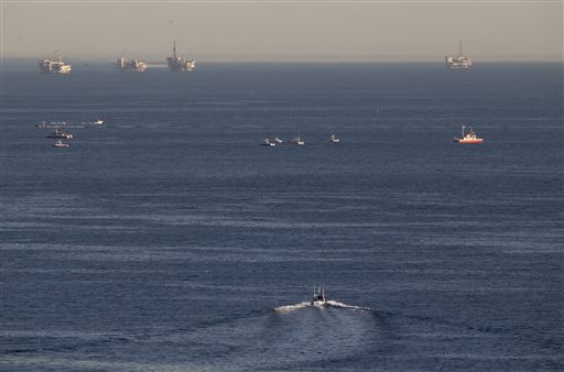 Rescue boats search for wreckage from two small planes that collided in midair and plunged into the ocean off of Los Angeles harbor Friday Feb. 5 2016 in San Pedro Calif. There was no immediate word of any survivors authorities said. The planes colli