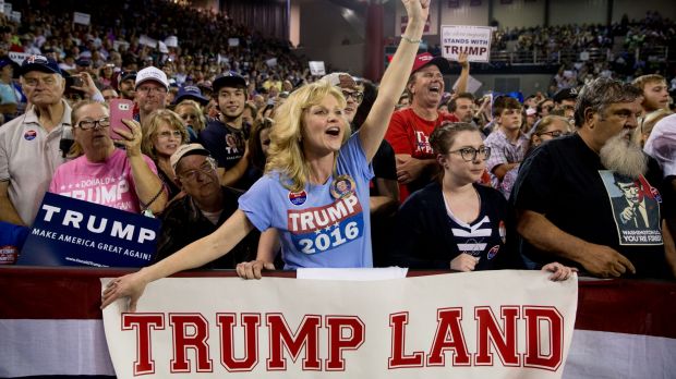 A member of the audience cheers as Republican presidential candidate Donald Trump speaks on Monday