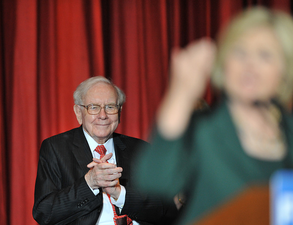 Billionaire Businessman Warren Buffett listens to Democratic Presidential Candidate Hillary Rodham Clinton at a Town Hall rally at Sokol Auditorium