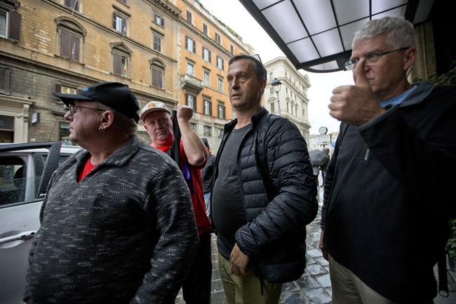 David Ridsdale second from right a survivor of priestly sex abuse stands in front of the Quirinale hotel in Rome Sunday Feb. 28 2016. A group of Australian survivors of priestly sex abuse and their relatives are in Rome to witness one of the highest