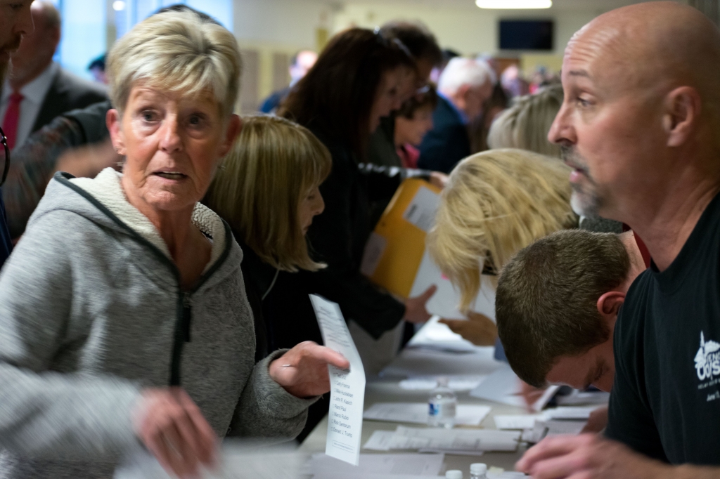 Jose Olivares  Nevada Sagebrush Republican caucusgoers look through their secret ballots at Reno High School on Tuesday Feb. 23. The caucus drew a record number of attendees as well as plenty of first-time voters the latter of which helped boost Donald T