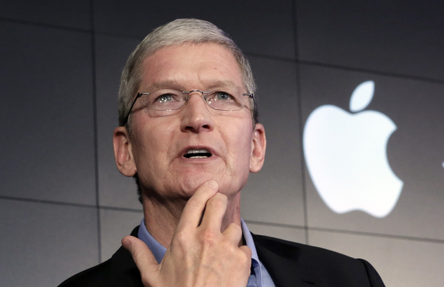 Apple CEO Tim Cook responds to a question during a news conference at IBM Watson headquarters in New York. There