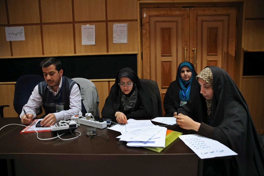 Iranian journalists wait for the announcement of results of parliamentary and Experts Assembly elections at the Interior Ministry in Tehran Iran Saturday Feb. 27 2016. Preliminary results early Saturday morning showed reformist candidates heading for