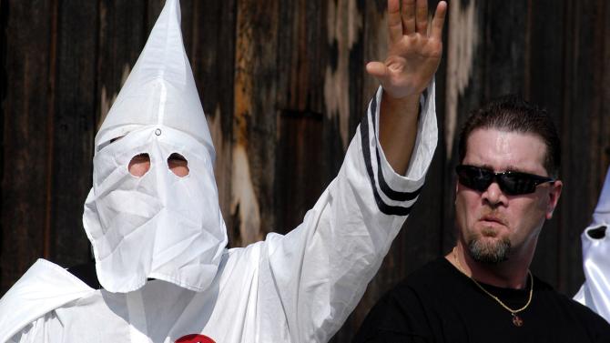 51358612-ku-klux-klan-member-salutes-during-an-american-nazi