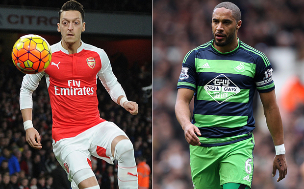 Mesut Ozil and Ashley Williams