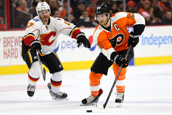 PHILADELPHIA PA- MARCH 03 Claude Giroux #28 of the Philadelphia Flyers skates past Lance Bouma #17 of the Calgary Flames at Wells Fargo Center