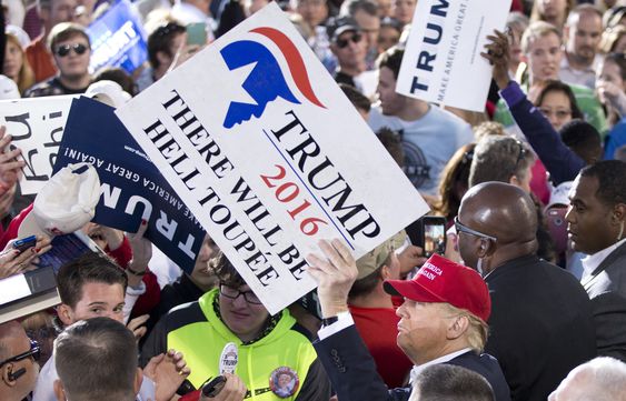 Donald Trump signs autographs during a rally Sunday Feb. 28 2016 in Madison Ala