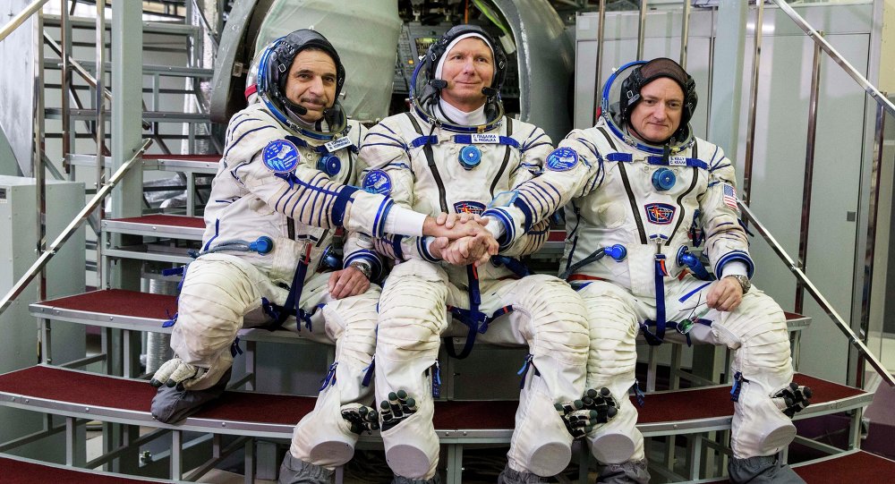 US astronaut Scott Kelly right Russian cosmonauts Gennady Padalka center and Mikhail Korniyenko pose before their final preflight practical examination