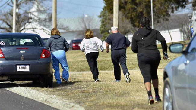 Parents run to see if they are allowed to pick up their kids at Madison Local Schools