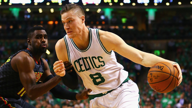 Jonas Jerebko drives against Tim Hardaway Jr. of the Atlanta Hawks during the first quarter of Game Three of the Eastern Conference Quarterfinals during the 2016 NBA Playoffs at TD Garden