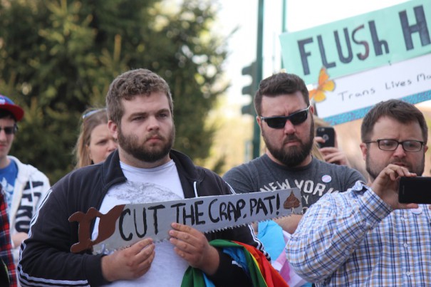 Protesters hold signs expressing their oppositon to HB2 Friday at the Historic Courthouse