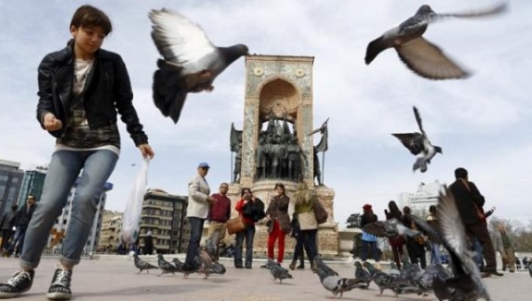 Tourists stroll at Taksim square in central Istanbul Turkey