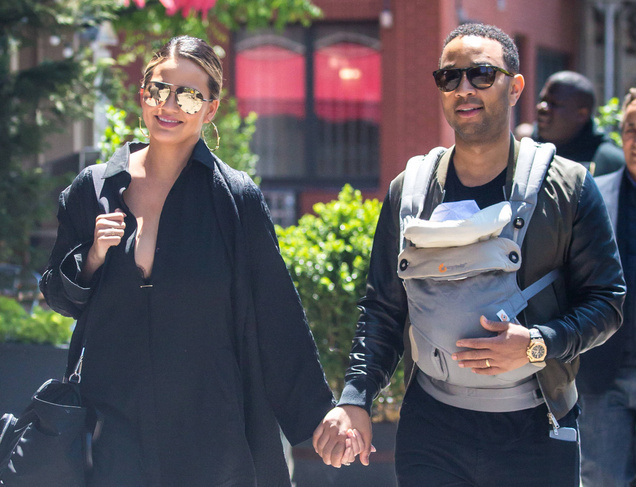 Chrissy Teigen and John Legend enjoying a stroll with their baby on a nice Spring Day