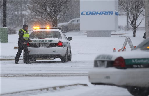 Police stand guard near a Planned Parenthood clinic Friday Nov. 27 2015 in Colorado Springs Colo. A gunman opened fire at the clinic on Friday authorities said wounding multiple people