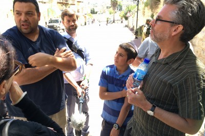 Writer Michael Chabon right speaks with a Jewish settler Ofer Ohana in Hebron West Bank in April