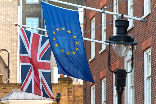 A British flag and the European flag