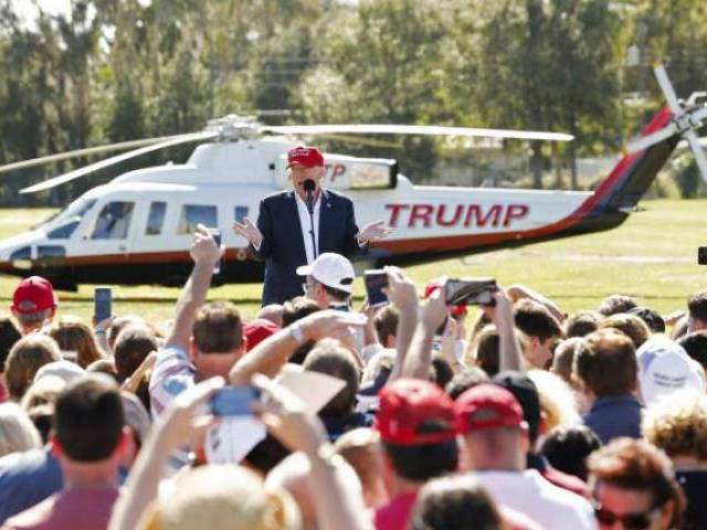 A Mexican flag waved in the breeze close by as Trump touched down on a golf course green in a helicopter