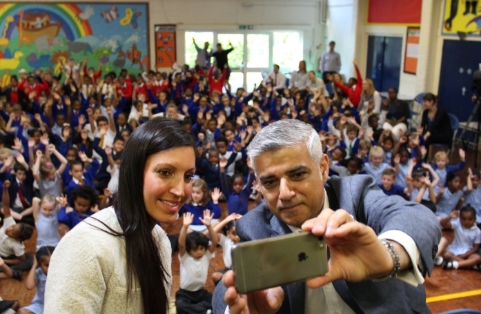 Allin-Khan and Khan posing at a local school recently