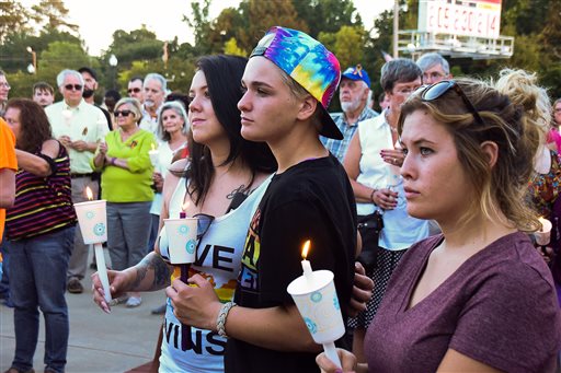 Samantha Sharrah and her sister Shauna Noumi,16 and Sadie Kochick along with other members of the community come out to the Orlando Vigil in honor of the of the victims of the Pulse Nightclub