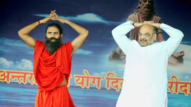 BJP boss Amit Shah and Baba Ramdev in Faridabad Rajnath Singh in Lucknow on Tuesday | PTI