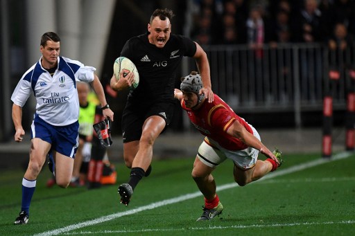 New Zealand's Israel Dagg runs out of a tackle by Jonathan Davies of Wales during the third rugby union Test match between the New Zealand All Blacks and Wales at Forsyth Barr Stadium in Dunedin