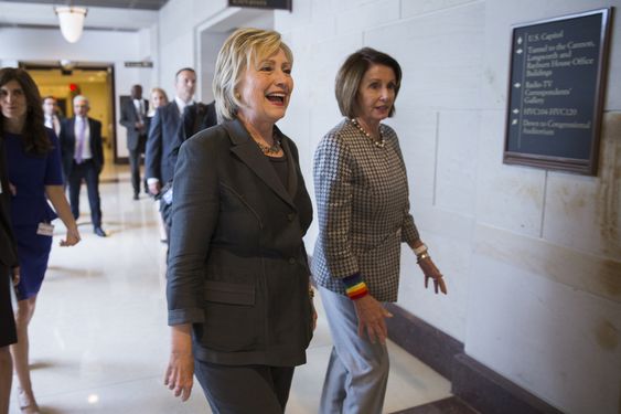 Nancy Pelosi of Calif. right escorts Democratic presidential candidate Hillary Clinton after a House Democratic caucus meeting on Capitol Hill in Washington Wednesday