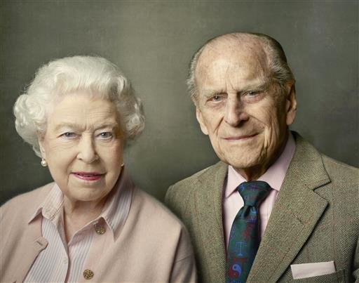 Britain's Queen Elizabeth II left and Prince Philip the Duke of Edinburgh pose for