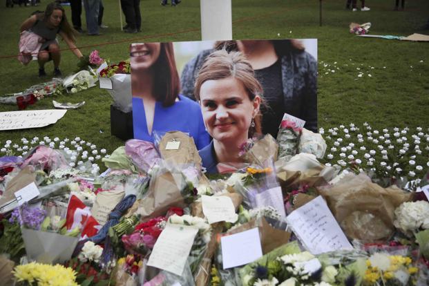 Tributes in memory of murdered Labour Party MP Jo Cox who was shot dead in Birstall are left at Parliament Square in London