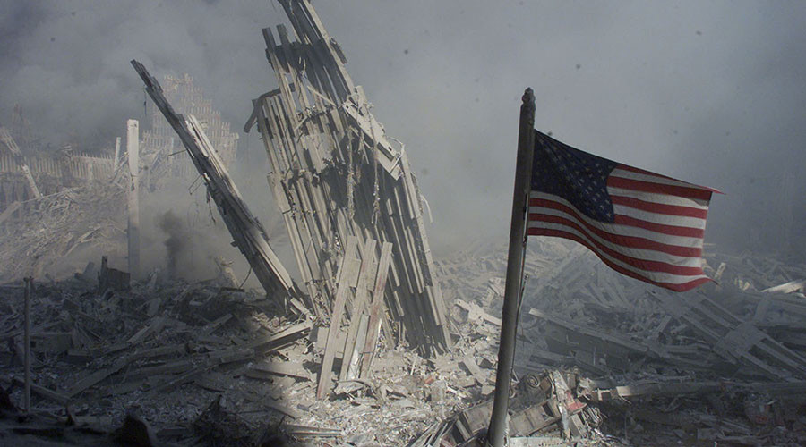 An American flag flies near the base of the destroyed World Trade Center in New York in this file