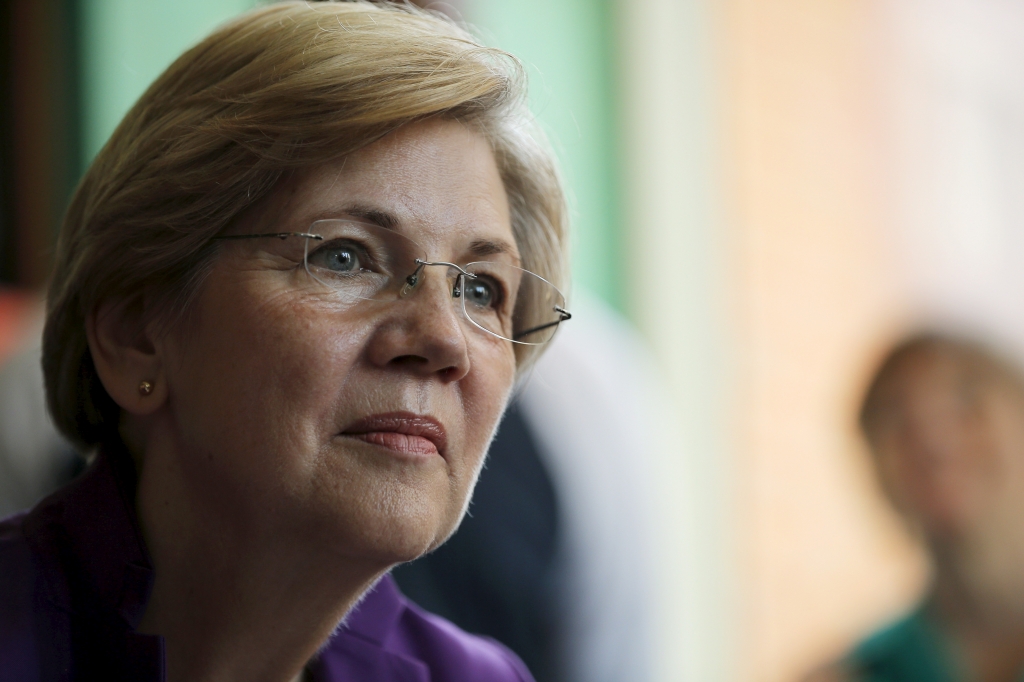 U.S. Senator Elizabeth Warren listens to workers tell their stories about erratic workplace schedules at the Equal Exchange Cafe in Boston