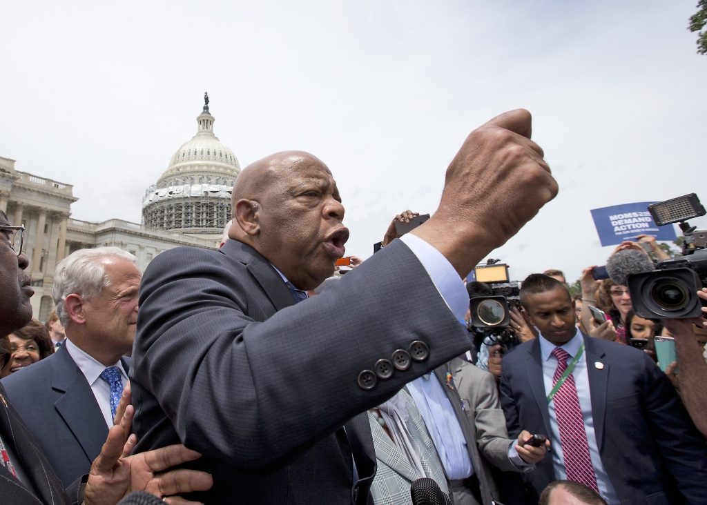 Rep. John Lewis D-Ga. center accompanied by fellow House Democrats from left House Assistant Minority Leader James Clyburn of S.C. Rep. Steve Israel D-N.Y. and others speaks on Capitol,Hill in Washington Thursday