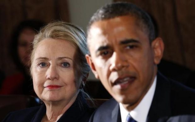 U.S. Secretary of State Hillary Clinton listens to U.S. President Barack Obama speak during a meeting with members of his cabinet at the White House in Washingt