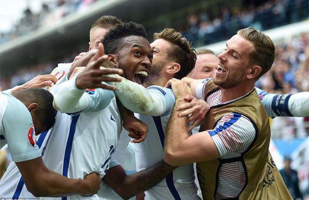 OH YOU BEAUTY!... Daniel Sturridge is mobbed by his England team-mates having come off the bench for the second half to find the back of the net in the dying minutes to snatch the winner for the Three Lions in their Euro 2016 match against Wales in Len