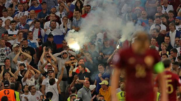 Russia fans let off flares during the match in Marseille- Uefa opened disciplinary proceedings against the Russian Football Union for alleged crowd disturbances racist behaviour and setting off fireworks